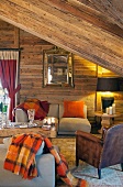Comfortable attic living room in wooden cabin