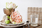Festive place setting with pink amaryllis blooms