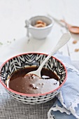 Chocolate sauce in small bowl