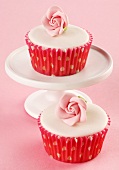 Cupcakes with white glaze and sugar roses