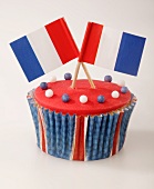 A cupcake decorated with French flags