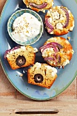 Greek-style muffins, with herbs, olives, feta and red onions