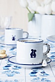 Espresso cups decorated with porcelain stickers (Dutch-style designs)