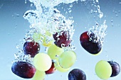 Grapes falling into water