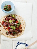 Tortilla with beef, tomatoes and avocados