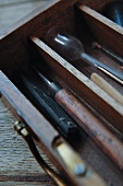 Antique painting utensils and tools in wooden box