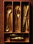 Antique Flatware in Wooden Utensil Divider; From Above