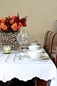 Table set with bouquet and tealight holder
