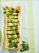 Filo pastry tart with peas, green asparagus and watercress