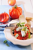 Baked tomato with cream cheese and herbs