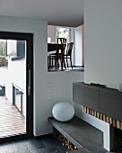 View into dining room from living room through opening in wall