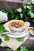 Baked pear and pumpkin soup with smoked duck breast
