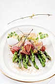 Steamed green asparagus with dry-cured ham and fried breadcrumbs, and eggs with Russian salad