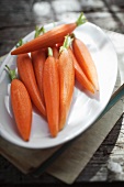 Peeled baby carrots on a plate