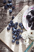 A summery still life of blueberries and blackberries