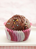 Chocolate muffins with decorative sprinkles