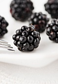 Blackberries on a white plate