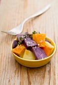 Steamed potatoes and sweet potatoes in a bowl