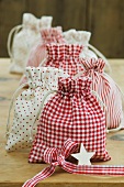 Little bags in various fabrics for Christmas presents