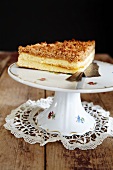 Apricot crumble cake on a torte stand