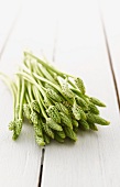 Wild asparagus on a wooden table