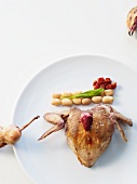Roasted quail with beans and dried tomatoes