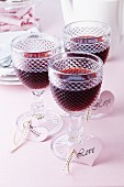 Glasses of wine with heart-shaped labels