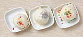 Three scoops of home-made ice cream with assorted decoration
