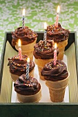Waffle cones with chocolate cream and birthday candles