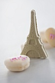 The Eiffel Tower made out of sugar, with macaroons