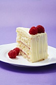 A slice of raspberry and white chocolate layer cake