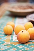 Apricots on mosaic tiles