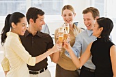 Businesspeople toasting with champagne