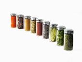 Studio shot of row of jars with spices