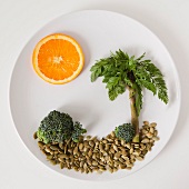Palm tree on plate made out of food, studio shot