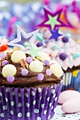 Cupcakes decorated with stars and candies for a party