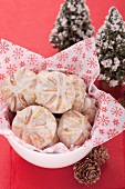 Gingerbread cookies in a dish lined with Christmas paper