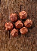 Whole hazelnuts on a wooden surface