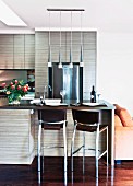Open kitchen with breakfast bar and chrome bar stools