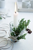 Arrangement with candle and sparkly star