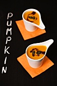 Cream of pumpkin soup in little bowls