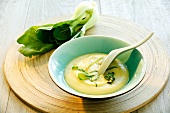 Cream of potato soup with ribbons of bok choi