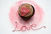 Chocolate cupcake with a red heart