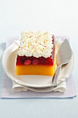 Peach-berry jelly topped with whipped cream