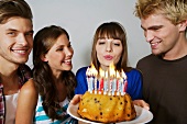 Germany, Berlin, Group of young people celebrating birthday