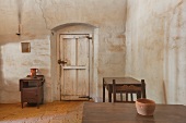 Room in an adobe building with furnishings, at Mission La Purisima State Historic Park, Lompoc, California