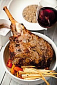 Grilled leg of lamb with oven vegetables and red wine