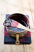 Boysenberry jam in a saucepan