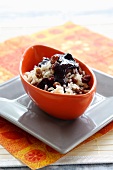 Coconut rice with raisins and blueberry sauce