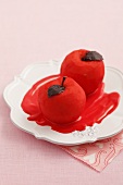 Red spiced poached apples with chocolate leaves